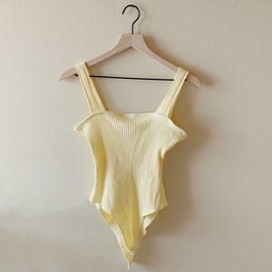 yellow bodysuit
